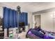 Small bedroom with double bed, closet, and window coverings at 6828 W Pierce St # 126, Phoenix, AZ 85043
