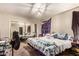 Primary bedroom with mirrored closet and ceiling fan at 6828 W Pierce St # 126, Phoenix, AZ 85043