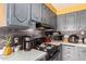 Kitchen with gray cabinets and gas stove at 6828 W Pierce St # 126, Phoenix, AZ 85043