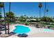 Community pool and spa with surrounding patio furniture at 6828 W Pierce St # 126, Phoenix, AZ 85043