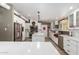 Modern kitchen with white cabinets, large island, and stainless steel appliances at 713 W Harwell Rd, Phoenix, AZ 85041