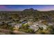 Aerial view of community near mountain, featuring several buildings at 7925 E Keim Dr, Scottsdale, AZ 85250