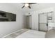 Bright bedroom with a queen bed, large closet and ceiling fan at 7925 E Keim Dr, Scottsdale, AZ 85250