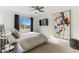 Modern bedroom featuring a bed, large art piece, and window at 7925 E Keim Dr, Scottsdale, AZ 85250