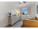 Charming bedroom with twin bed, dresser, and window at 7925 E Keim Dr, Scottsdale, AZ 85250