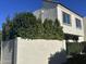 View of the building's exterior, showing landscaping and stucco at 7925 E Keim Dr, Scottsdale, AZ 85250
