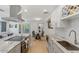 Modern kitchen featuring granite countertops, stainless steel appliances, and an island at 7925 E Keim Dr, Scottsdale, AZ 85250