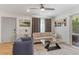 Bright living room features a comfy sofa, stylish coffee table, and large windows at 7925 E Keim Dr, Scottsdale, AZ 85250