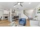 Open living room with kitchen island, staircase, and seating at 7925 E Keim Dr, Scottsdale, AZ 85250