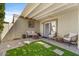 Relaxing patio area with pergola and artificial turf at 7925 E Keim Dr, Scottsdale, AZ 85250