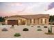 Single-story home with a two-car garage and desert landscaping at 8170 W Peat Cir, Arizona City, AZ 85123