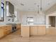 Modern kitchen with a large island and stainless steel appliances at 8849 E Via Del Sol Dr, Scottsdale, AZ 85255