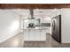 Modern kitchen with granite island, white cabinets, and stainless steel appliances at 905 E Weldon Ave, Phoenix, AZ 85014