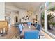 Open dining area with hardwood floors and view into living room at 9137 N 116Th Pl, Scottsdale, AZ 85259