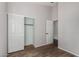 Bright bedroom with wood-look tile floor and closet at 9523 E Placer Dr, Gold Canyon, AZ 85118