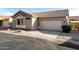 Single story home with two car garage and desert landscaping at 9523 E Placer Dr, Gold Canyon, AZ 85118