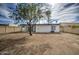 Large backyard with a view of the home's exterior at 10422 W Calle De Edens --, Phoenix, AZ 85037