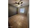 Simple bedroom with ceiling fan and tiled floors at 11331 N Langford Ave, Youngtown, AZ 85363