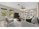 Living room with modern furniture and a view to the backyard at 11526 E Diamond Cholla Dr, Scottsdale, AZ 85255