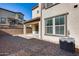 Private backyard with gravel landscaping and access to patio at 1255 N Arizona Ave # 1276, Chandler, AZ 85225