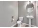 Clean bathroom with pedestal sink and oval mirror at 1255 N Arizona Ave # 1276, Chandler, AZ 85225