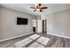 Spacious bedroom with wood-look floors and ceiling fan at 1255 N Arizona Ave # 1276, Chandler, AZ 85225
