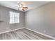 Bright bedroom with wood-look floors and window at 1255 N Arizona Ave # 1276, Chandler, AZ 85225