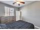 Bedroom with queen bed, dresser, and ceiling fan at 1255 N Arizona Ave # 1276, Chandler, AZ 85225