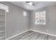 Bright bedroom with wood-look floors and built-in shelving at 1255 N Arizona Ave # 1276, Chandler, AZ 85225