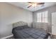 Bedroom with queen bed, dresser, and ceiling fan at 1255 N Arizona Ave # 1276, Chandler, AZ 85225