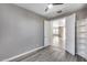 Bedroom with view into living area and built-in shelving at 1255 N Arizona Ave # 1276, Chandler, AZ 85225