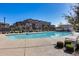 Community pool with surrounding patio and loungers at 1255 N Arizona Ave # 1276, Chandler, AZ 85225