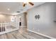 Upstairs hallway with white railing and wood floors at 1255 N Arizona Ave # 1276, Chandler, AZ 85225