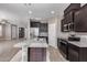 Modern kitchen with granite island and stainless steel appliances at 1255 N Arizona Ave # 1276, Chandler, AZ 85225