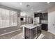 Granite island kitchen with stainless steel appliances and breakfast bar at 1255 N Arizona Ave # 1276, Chandler, AZ 85225