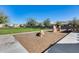 Community playground with wood chips and play equipment at 1255 N Arizona Ave # 1276, Chandler, AZ 85225