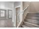 Modern staircase with wood-look treads and white railing at 1255 N Arizona Ave # 1276, Chandler, AZ 85225