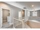 Upstairs hall with laundry closet and access to bedrooms at 1255 N Arizona Ave # 1276, Chandler, AZ 85225