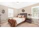 Cozy bedroom with a double bed and window with plantation shutters at 1330 S Aaron -- # 187, Mesa, AZ 85209