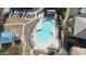 Community pool with surrounding lounge chairs and playground at 1330 S Aaron -- # 187, Mesa, AZ 85209