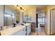 Elegant bathroom with double sinks, modern vanity, and shower at 15420 N 160Th Ln, Surprise, AZ 85374