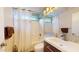 Clean bathroom with a shower/tub combo, white vanity, and mosaic tile at 15420 N 160Th Ln, Surprise, AZ 85374