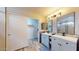 Modern bathroom with double vanity, walk-in shower, and linen closet at 15420 N 160Th Ln, Surprise, AZ 85374