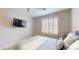 Spacious bedroom featuring a queen bed, large window, and wood floors at 15420 N 160Th Ln, Surprise, AZ 85374