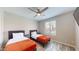 Bedroom with two twin beds, ceiling fan and large window with blinds at 15420 N 160Th Ln, Surprise, AZ 85374