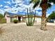 Single-story home with solar panels, desert landscaping, and a two-car garage at 15420 N 160Th Ln, Surprise, AZ 85374