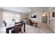 Bright living room with hardwood floors, a dining area, and a brown leather couch at 15420 N 160Th Ln, Surprise, AZ 85374