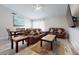 Relaxing living room with leather couches and a large TV at 15420 N 160Th Ln, Surprise, AZ 85374