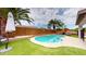 Inviting kidney-shaped pool with surrounding landscaping at 15420 N 160Th Ln, Surprise, AZ 85374