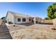 Backyard with gravel, covered patio, and sand area at 1676 W Harvard Ave, Gilbert, AZ 85233